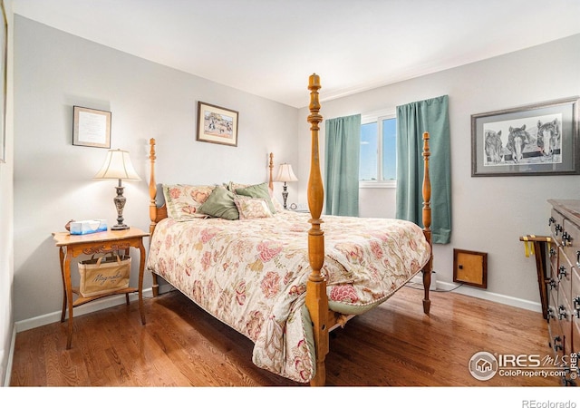3412 Erving Ct, Berthoud, CO 80513 - bedroom featuring wood finished floors and baseboards