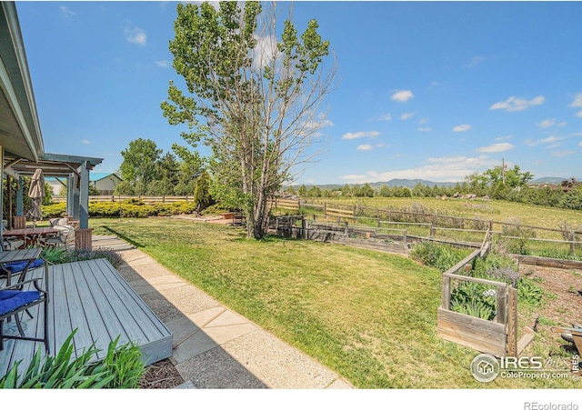 3412 Erving Ct, Berthoud, CO 80513 - view of yard with a rural view, a deck, and a vegetable garden