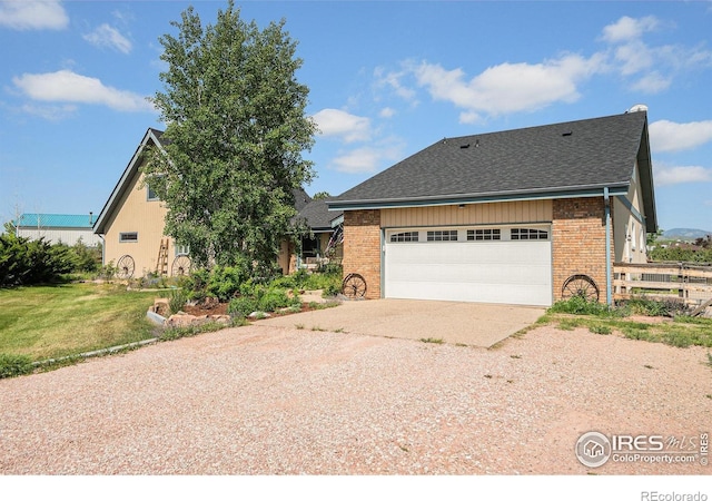 3412 Erving Ct, Berthoud, CO 80513 - view of front of property with concrete driveway, brick siding, and roof with shingles