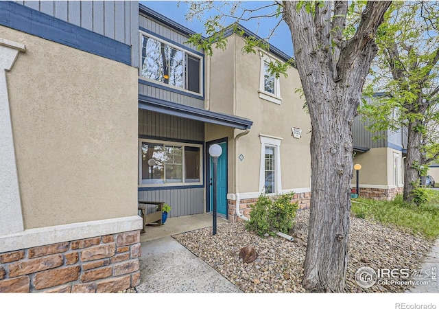 855 W Moorhead Cir Unit C, Boulder, CO 80305 - view of exterior entry with stone siding and stucco siding
