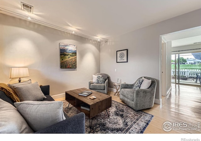 855 W Moorhead Cir Unit C, Boulder, CO 80305 - living room featuring light wood-style flooring and baseboards