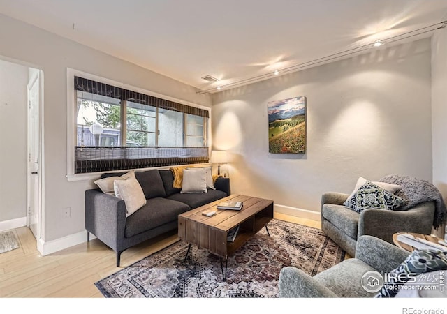 855 W Moorhead Cir Unit C, Boulder, CO 80305 - living room featuring wood finished floors and baseboards