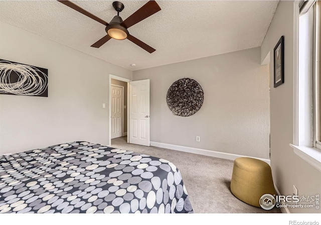 855 W Moorhead Cir Unit C, Boulder, CO 80305 - bedroom featuring carpet flooring, a textured ceiling, ceiling fan, and baseboards