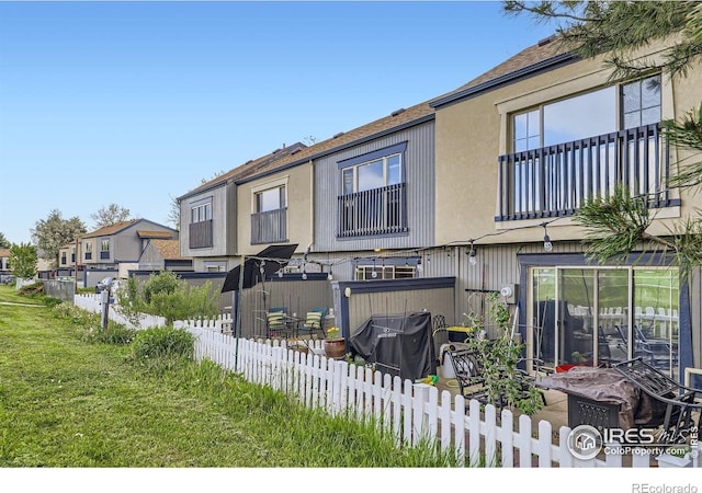 855 W Moorhead Cir Unit C, Boulder, CO 80305 - view of front of property with a balcony, stucco siding, and a shingled roof
