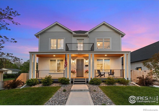 3256 S Corona St, Englewood, CO 80113 - view of front facade featuring covered porch and a balcony