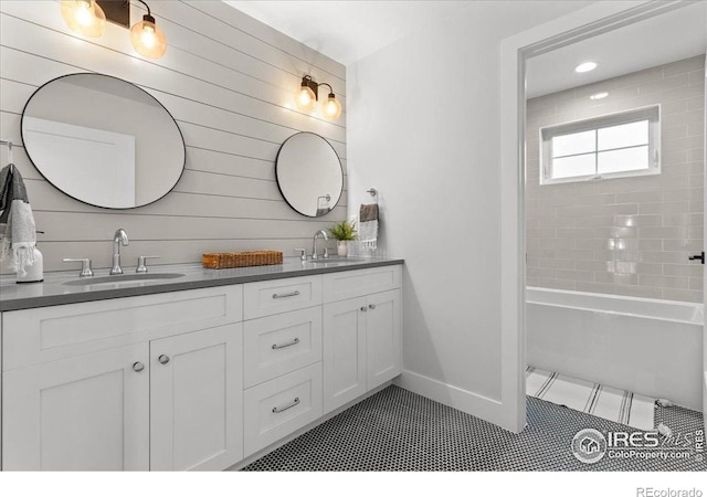 3256 S Corona St, Englewood, CO 80113 - full bathroom featuring double vanity, tile patterned floors, and shower / washtub combination
