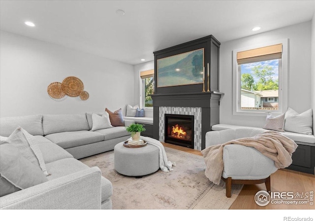 3256 S Corona St, Englewood, CO 80113 - living area with wood finished floors, recessed lighting, and a glass covered fireplace