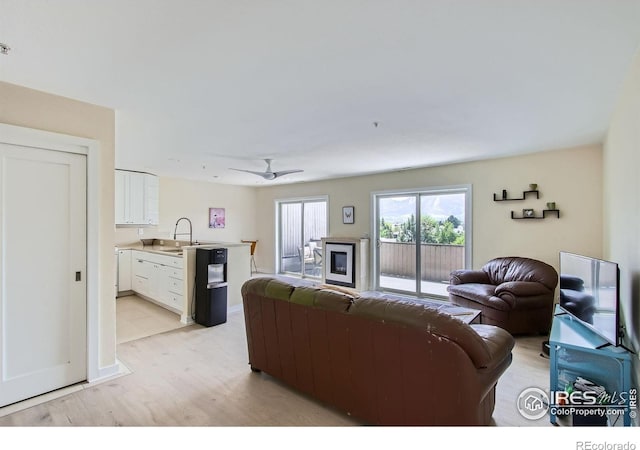 2938 Kalmia Ave Unit 26, Boulder, CO 80301 - living room with light wood-style flooring and ceiling fan