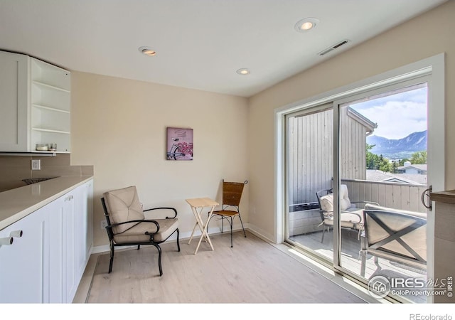 2938 Kalmia Ave Unit 26, Boulder, CO 80301 - living area with light wood finished floors, a mountain view, baseboards, and recessed lighting