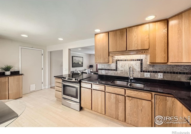 630 S 45th St, Boulder, CO 80305 - kitchen featuring electric range, a sink, decorative backsplash, recessed lighting, and light wood-style flooring
