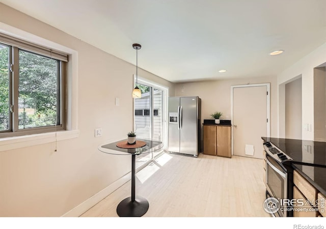 630 S 45th St, Boulder, CO 80305 - kitchen featuring stainless steel appliances, light wood-style flooring, recessed lighting, hanging light fixtures, and dark countertops