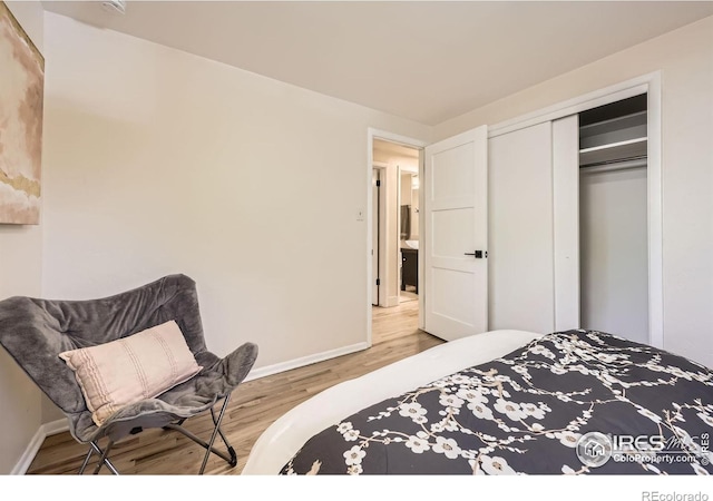 630 S 45th St, Boulder, CO 80305 - bedroom featuring light wood finished floors, baseboards, and a closet