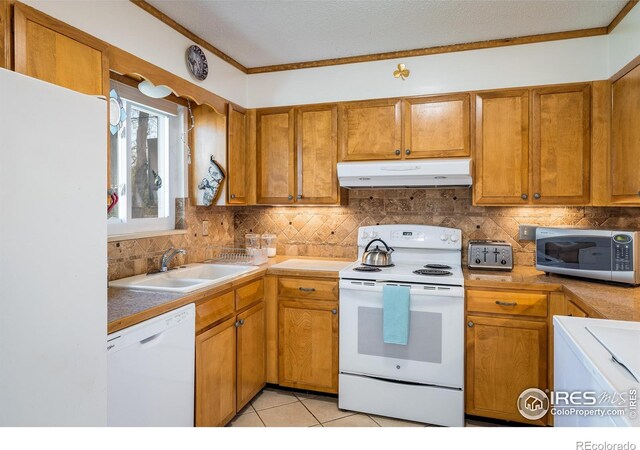 1542 Kilkenny St, Boulder, CO 80303 - kitchen featuring white appliances, under cabinet range hood, a sink, brown cabinets, and backsplash