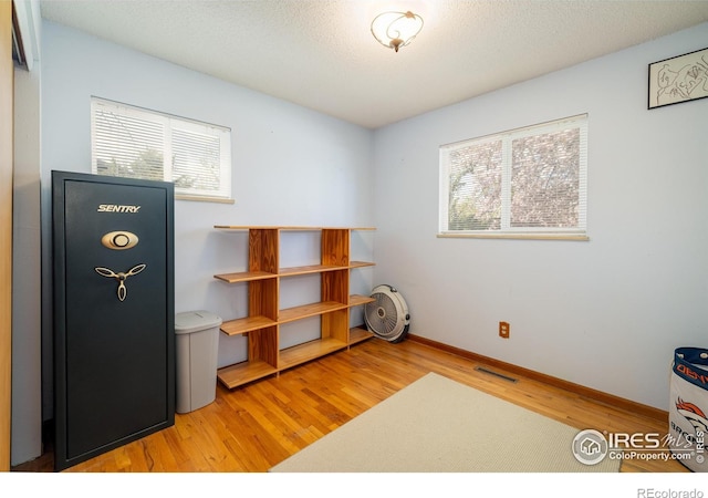 1542 Kilkenny St, Boulder, CO 80303 - office area with plenty of natural light, wood finished floors, and baseboards