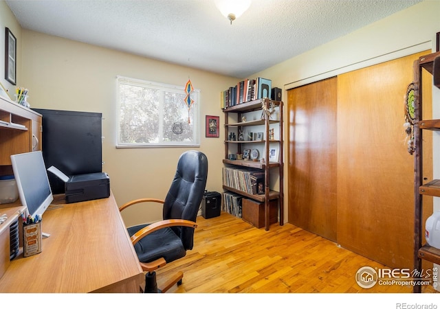1542 Kilkenny St, Boulder, CO 80303 - office area with wood finished floors and a textured ceiling