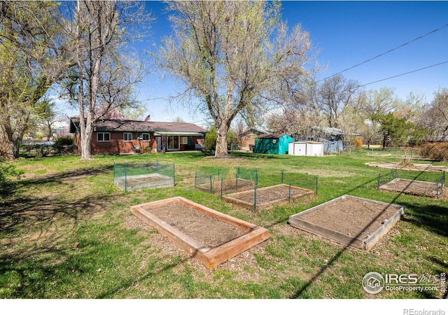 1542 Kilkenny St, Boulder, CO 80303 - view of grassy yard featuring a vegetable garden