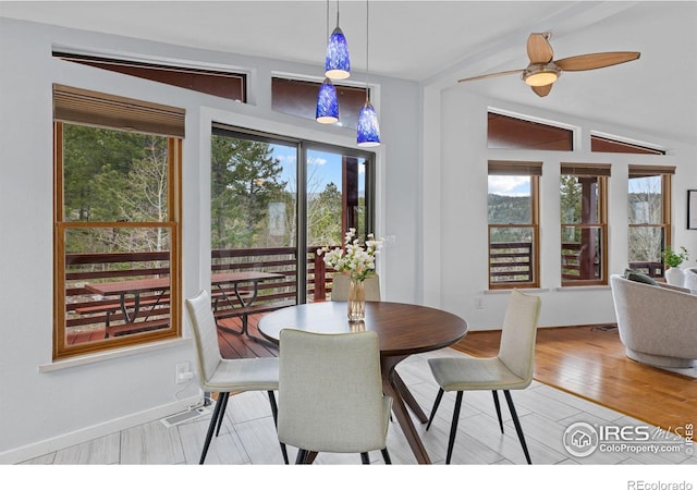 880 Hummer Dr, Nederland, CO 80466 - dining area featuring plenty of natural light, wood finished floors, vaulted ceiling, and a ceiling fan