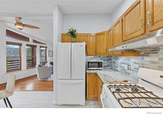 880 Hummer Dr, Nederland, CO 80466 - kitchen with white appliances, under cabinet range hood, tasteful backsplash, a ceiling fan, and light stone countertops