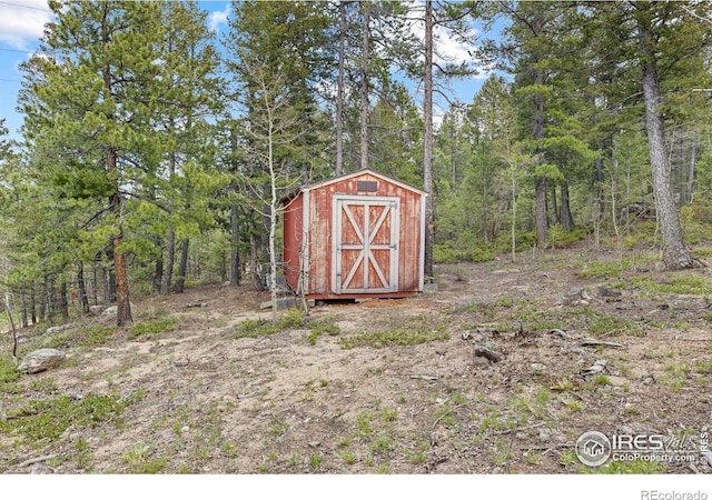 880 Hummer Dr, Nederland, CO 80466 - view of shed featuring a wooded view