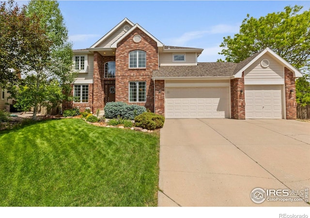 5751 Round Rock Ct, Fort Collins, CO 80528 - view of front of home with brick siding, concrete driveway, a front yard, a garage, and a shingled roof