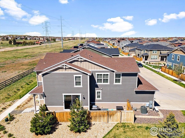 17616 Bluetrail Ave, Parker, CO 80134 - rear view of property featuring board and batten siding, roof with shingles, and a residential view