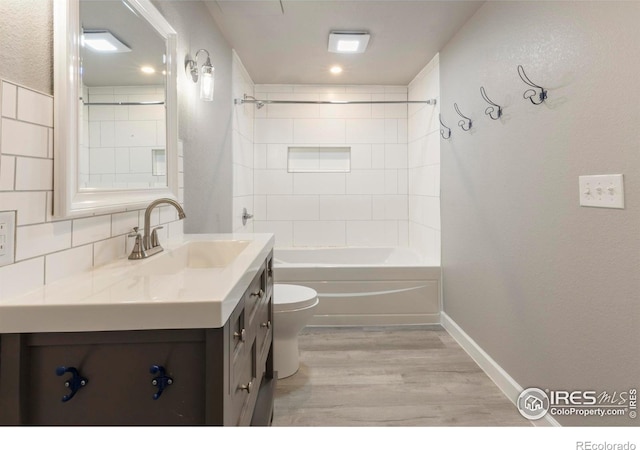 17616 Bluetrail Ave, Parker, CO 80134 - bathroom featuring vanity, wood finished floors,  shower combination, and recessed lighting