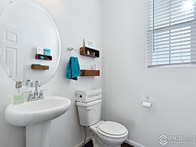 17616 Bluetrail Ave, Parker, CO 80134 - bathroom featuring toilet and a sink