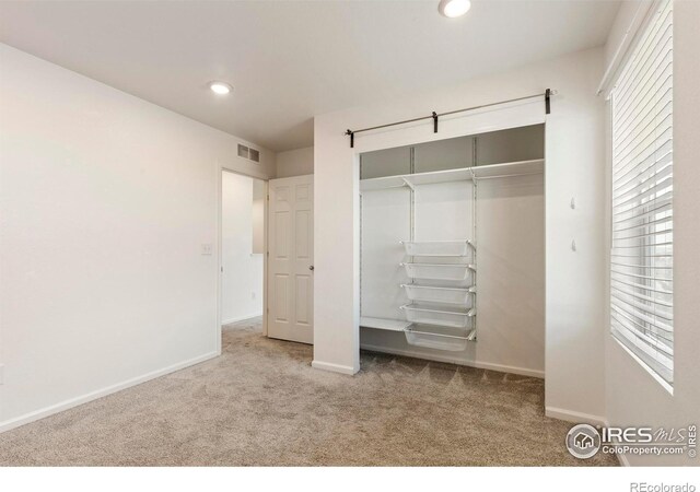 17616 Bluetrail Ave, Parker, CO 80134 - unfurnished bedroom with carpet, a closet, and recessed lighting