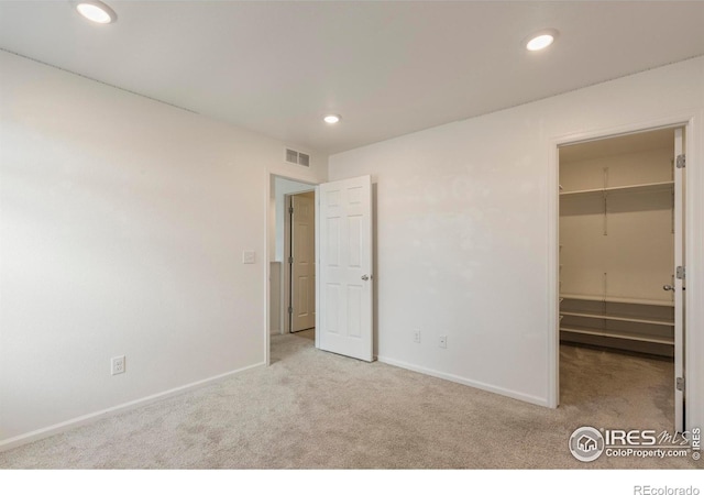 17616 Bluetrail Ave, Parker, CO 80134 - unfurnished bedroom with carpet flooring, a walk in closet, and recessed lighting