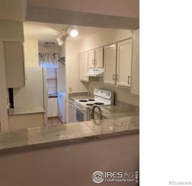 2929 W 81st Ave Unit H, Westminster, CO 80031 - kitchen featuring electric stove, ventilation hood, and light countertops