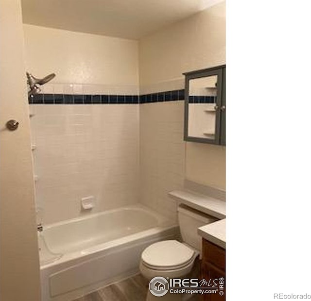 2929 W 81st Ave Unit H, Westminster, CO 80031 - bathroom featuring toilet, vanity, and shower / bathtub combination