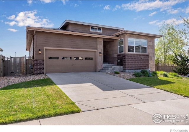 4000 Donnington Cir, Castle Rock, CO 80104 - view of front of house with brick siding, driveway, and a garage