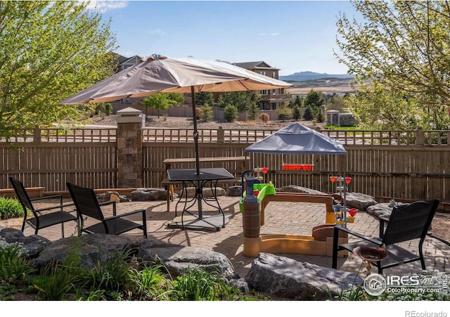 4000 Donnington Cir, Castle Rock, CO 80104 - fenced backyard with a mountain view and a patio area