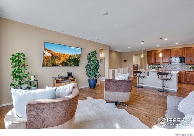4000 Donnington Cir, Castle Rock, CO 80104 - living room featuring light wood-style flooring, recessed lighting, and baseboards