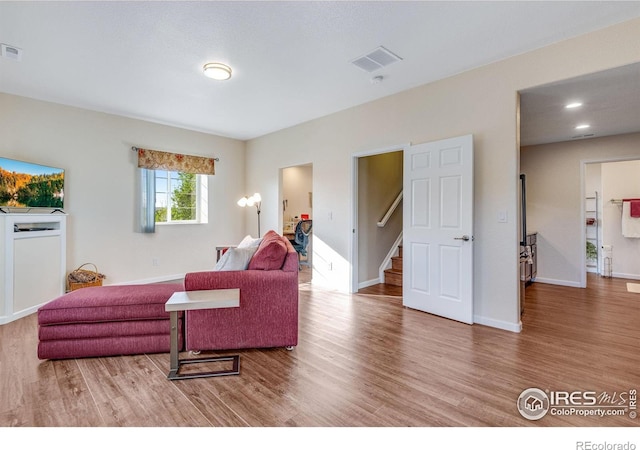 4000 Donnington Cir, Castle Rock, CO 80104 - living area featuring wood finished floors, stairway, and baseboards