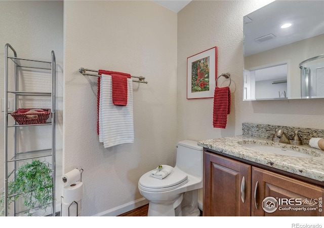 4000 Donnington Cir, Castle Rock, CO 80104 - bathroom with vanity, toilet, baseboards, and wood finished floors