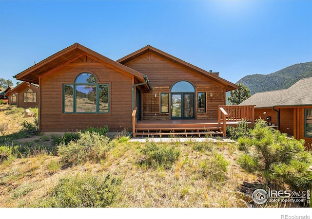 683 Cedar Ridge Cir, Estes Park, CO 80517 - view of front of property with a deck with mountain view and french doors
