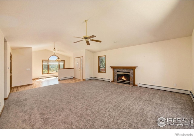 683 Cedar Ridge Cir, Estes Park, CO 80517 - unfurnished living room featuring carpet floors, a baseboard heating unit, lofted ceiling, and a ceiling fan