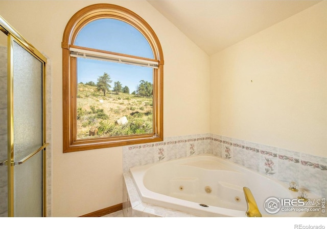 683 Cedar Ridge Cir, Estes Park, CO 80517 - bathroom featuring a tub with jets, lofted ceiling, and a shower with door
