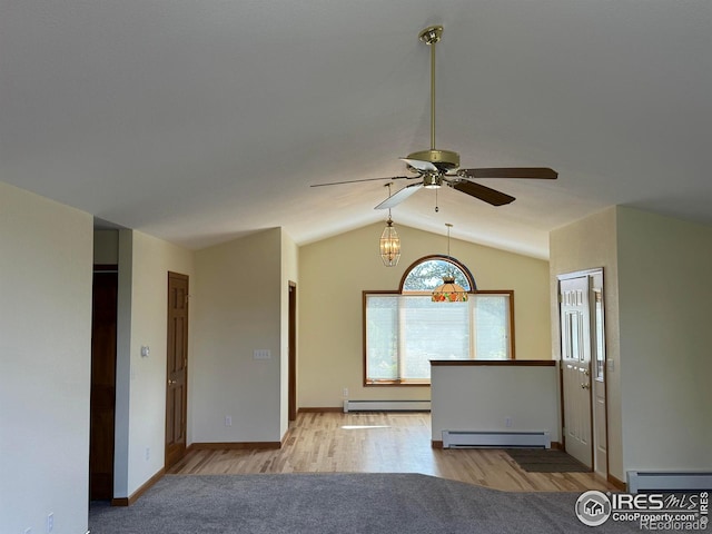 683 Cedar Ridge Cir, Estes Park, CO 80517 - empty room with a baseboard radiator, lofted ceiling, baseboard heating, ceiling fan, and wood finished floors
