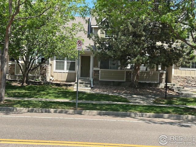 2218 Stetson Creek Dr Unit C, Fort Collins, CO 80528 - obstructed view of property featuring stone siding