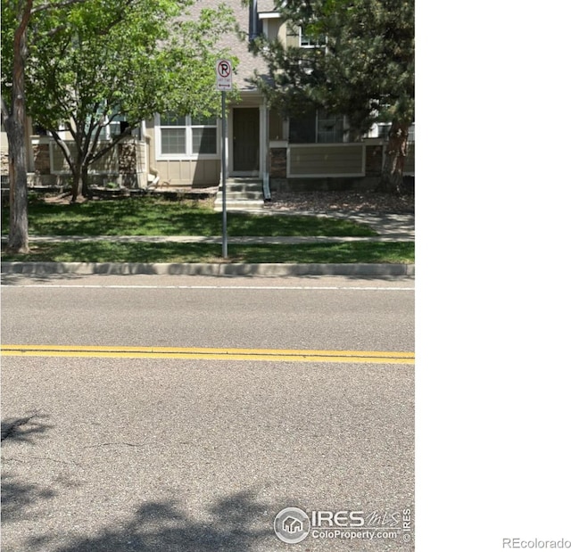 2218 Stetson Creek Dr Unit C, Fort Collins, CO 80528 - obstructed view of property with a front lawn