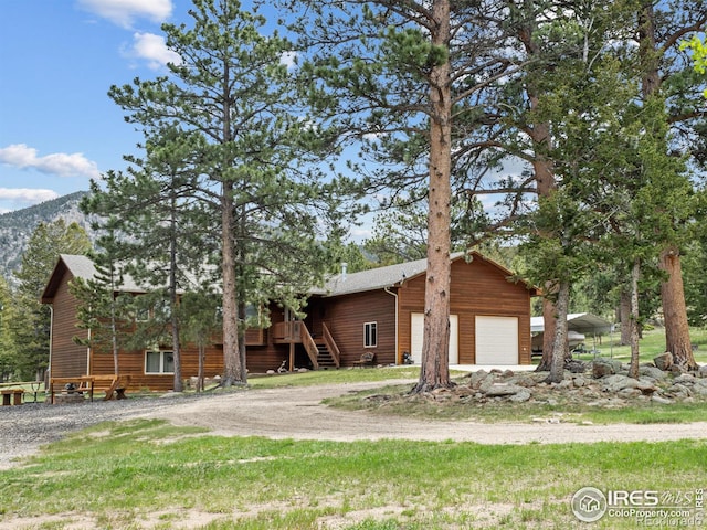 3807 Dollar Lake Dr, Estes Park, CO 80517 - view of front of property with a garage, stairs, and driveway