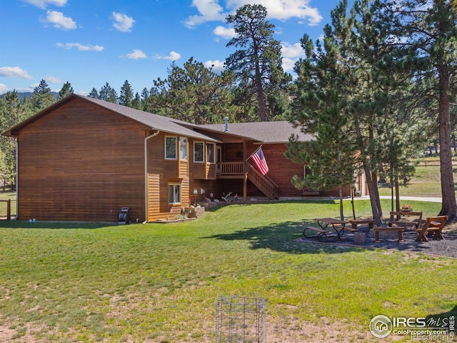 3807 Dollar Lake Dr, Estes Park, CO 80517 - back of house featuring stairs, a yard, and a wooden deck