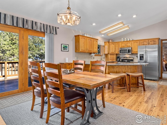 3807 Dollar Lake Dr, Estes Park, CO 80517 - dining area with light wood-style flooring, lofted ceiling, a chandelier, and recessed lighting