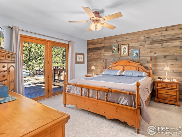3807 Dollar Lake Dr, Estes Park, CO 80517 - bedroom featuring light colored carpet, access to exterior, wooden walls, and ceiling fan
