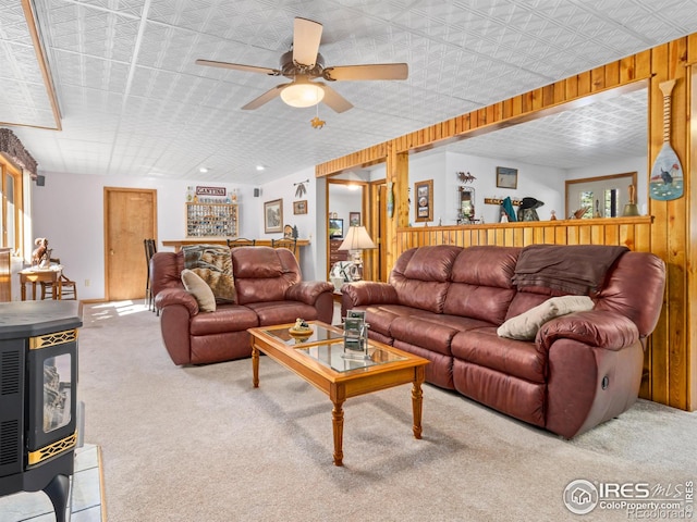3807 Dollar Lake Dr, Estes Park, CO 80517 - carpeted living room with ceiling fan, an ornate ceiling, and wooden walls