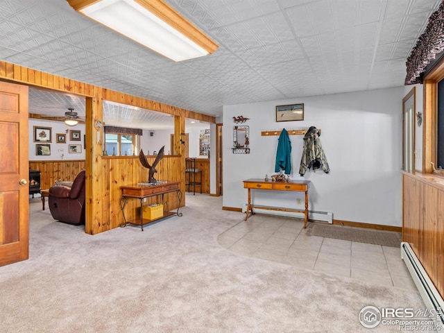 3807 Dollar Lake Dr, Estes Park, CO 80517 - corridor with a baseboard radiator, wooden walls, carpet floors, and baseboards