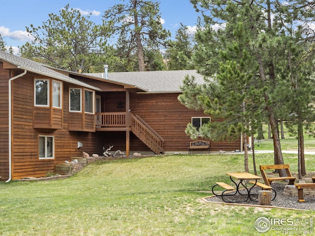 3807 Dollar Lake Dr, Estes Park, CO 80517 - rear view of property with a yard, roof with shingles, and stairway