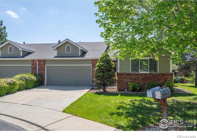 1528 16th Pl, Longmont, CO 80501 - view of front of property featuring brick siding, a garage, and a front yard